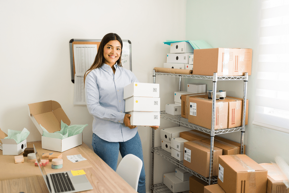 Young woman packing handmade soap to ship out to customers