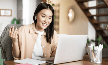 young woman working on her laptop at home