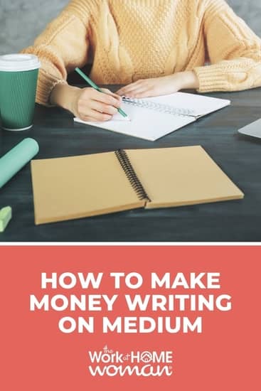 Woman writing at desk in home office