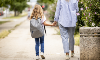 Mom walking daughter to school for blog post jobs during school hours