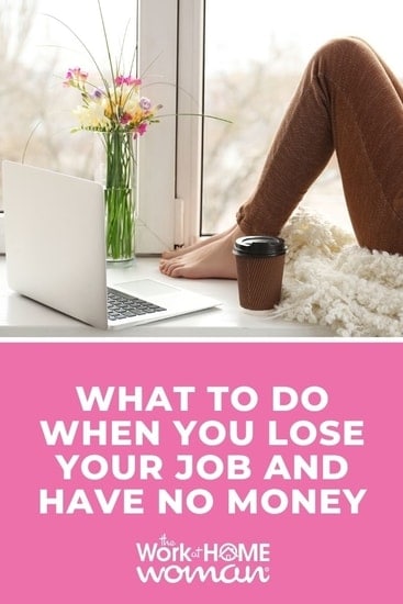 Woman sitting at home on window sill, working on laptop.