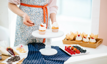 woman baking cupcakes to sell from home