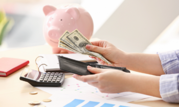 Woman counting money and saving for retirement