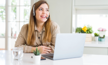 Woman taking calls for her Alorica work from home job