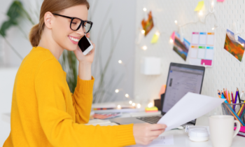 Woman working at her desk at home for blog post 99 career ideas