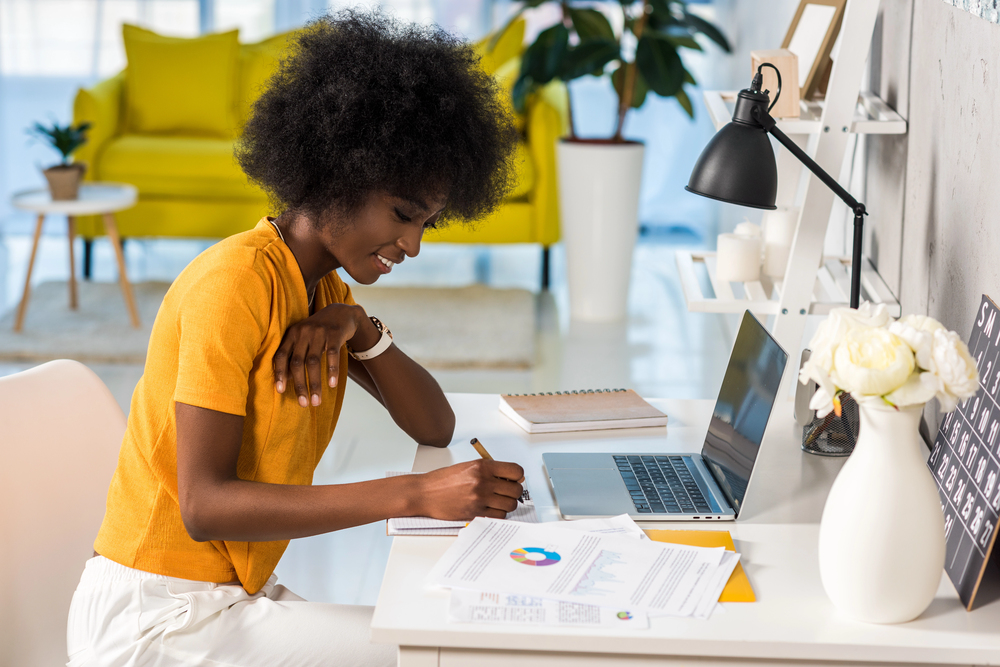 Young black woman working her remote banking jobs