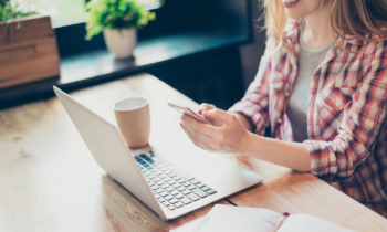 Young woman testing websites and apps for cash