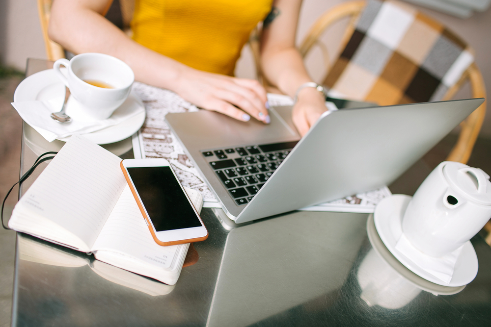 woman working from home outdoors on her laptop - career ideas